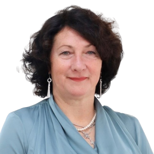 Smiling woman wearing blue blouse and pearls