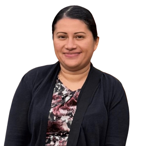 Smiling woman in patterned blouse and dark cardigan