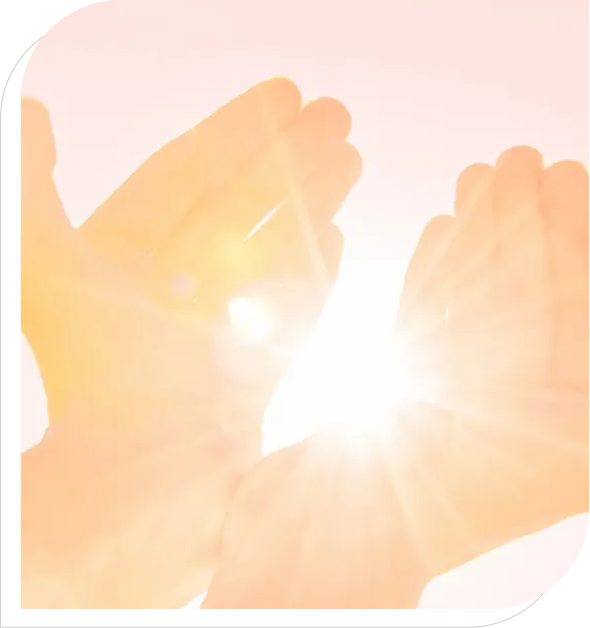 Hands cupping bright sunlight